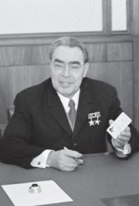 Л. И. Брежнев подписывает партийный билет № I В. И. Ульянову-Ленину
